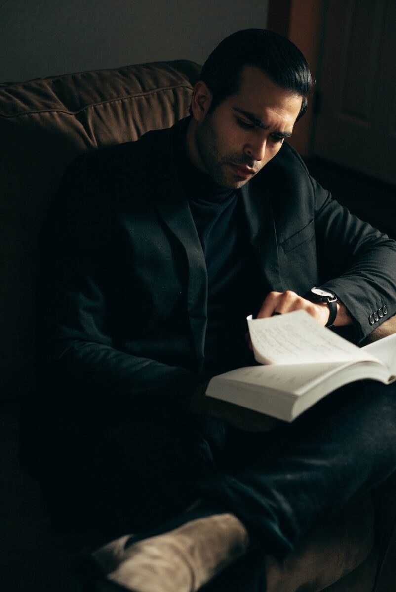 Gentleman Givenchy Reserve Privée EDP Review: Smooth, Distinct & Boozy man reading a book in office