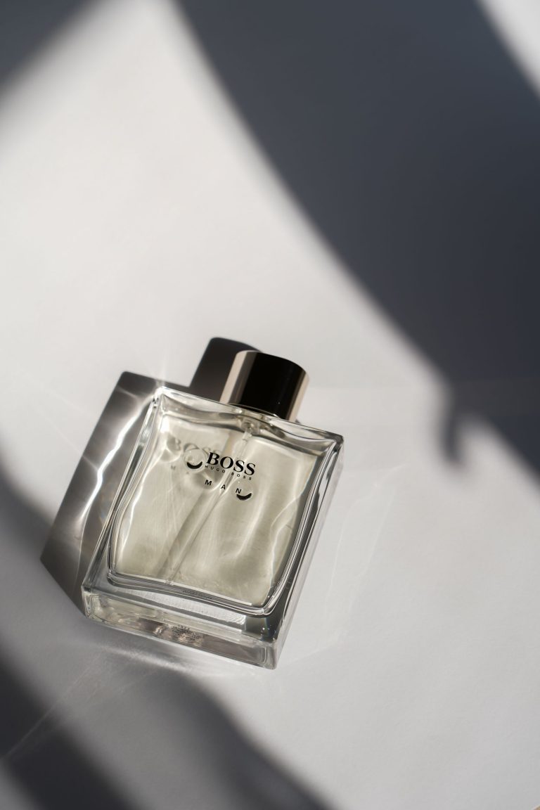Luxurious clear perfume bottle in soft light
