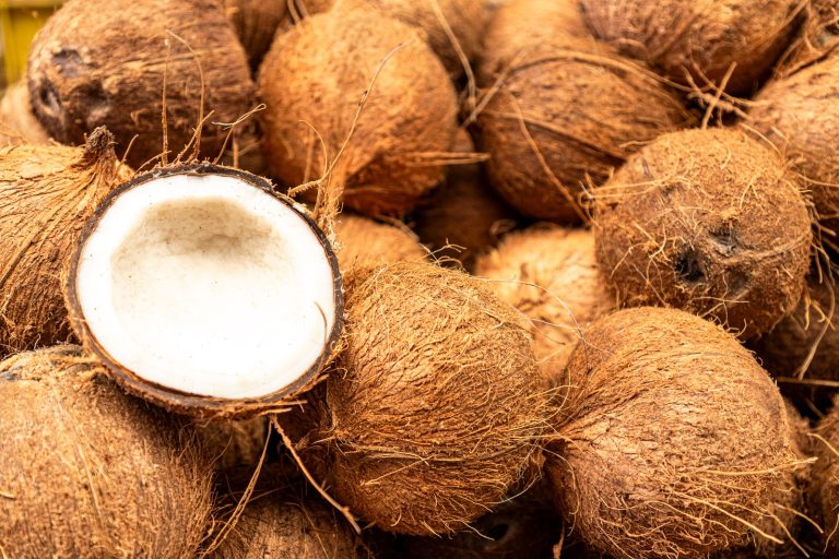 Whole and halved coconuts