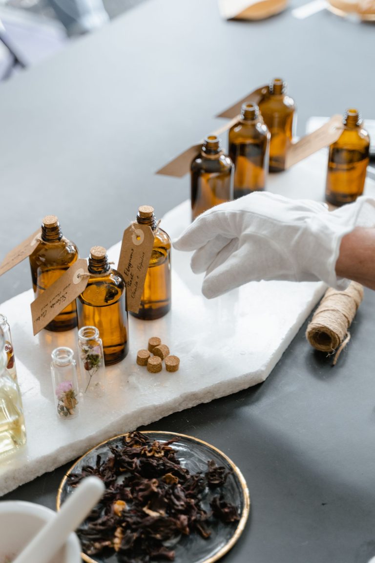 Modern perfume bottles on a white table
