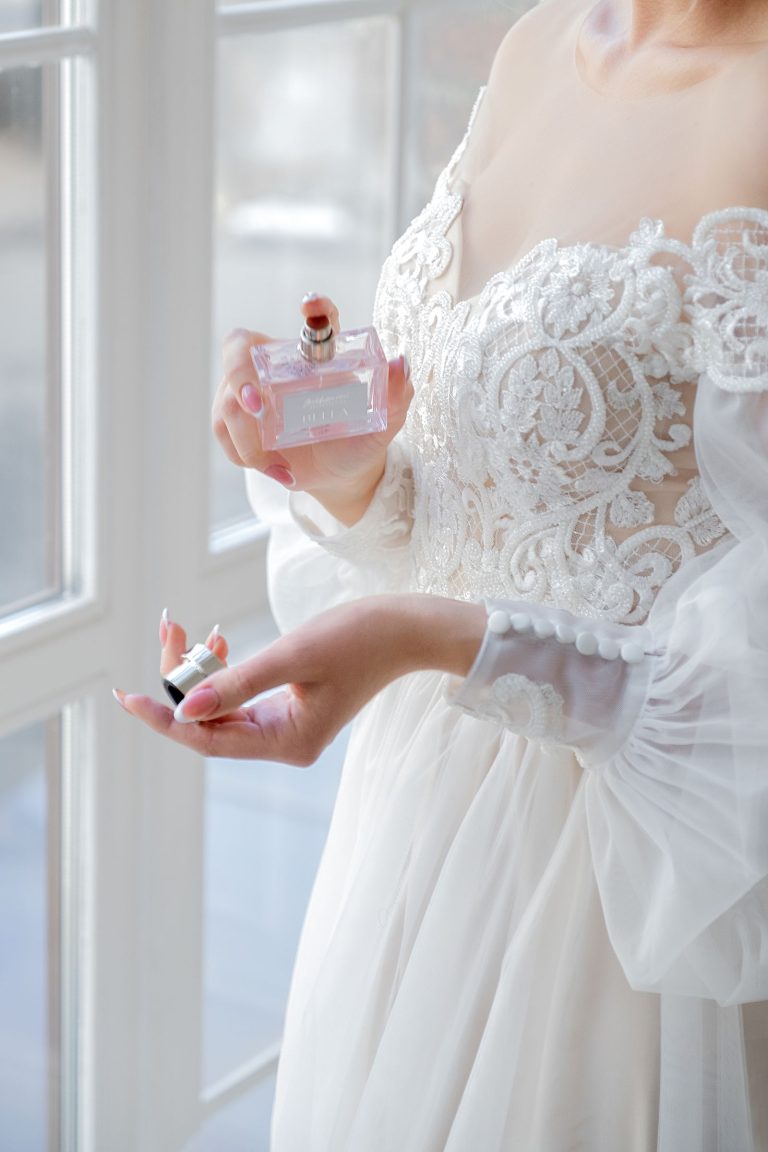 Holding a perfume bottle