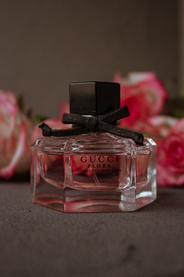 Perfume bottle with a bouquet of roses