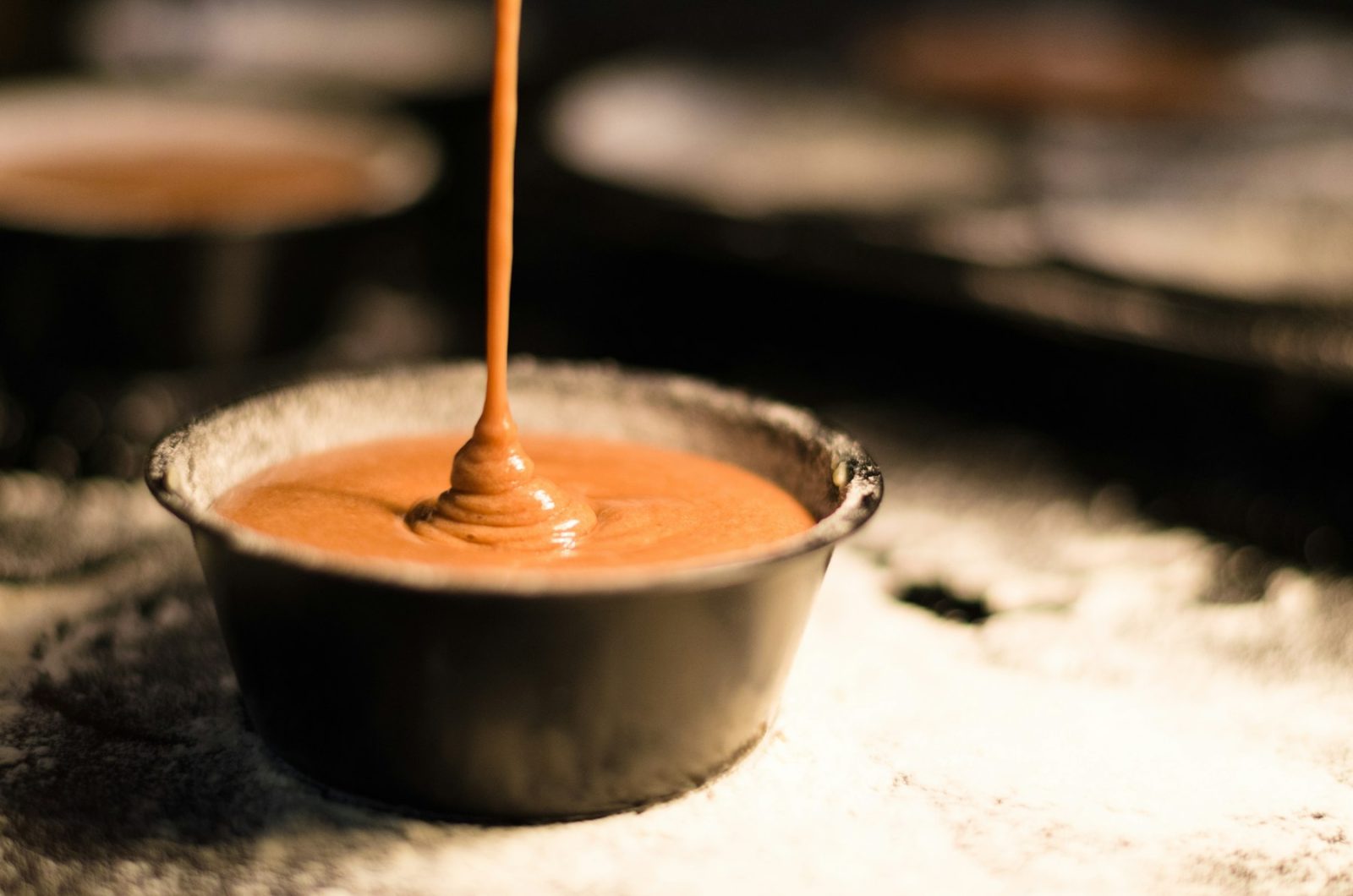 What Does Caramel Smell Like? Molten caramel being poured into a pan, sugar browning through the Maillard reaction