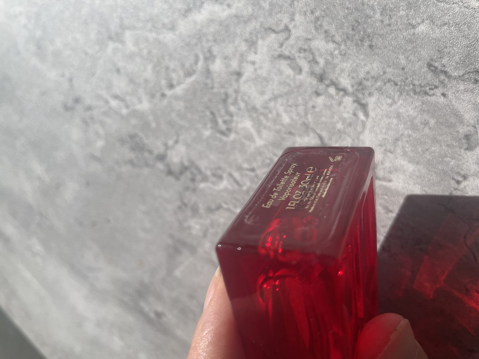 Elizabeth Arden’s Red Door Perfume Review: An Ageless Classic? Base of the Elizabeth Arden Red Door bottle reading Eau de Toilette Spray, 1 FL.OZ 30ml, made in USA