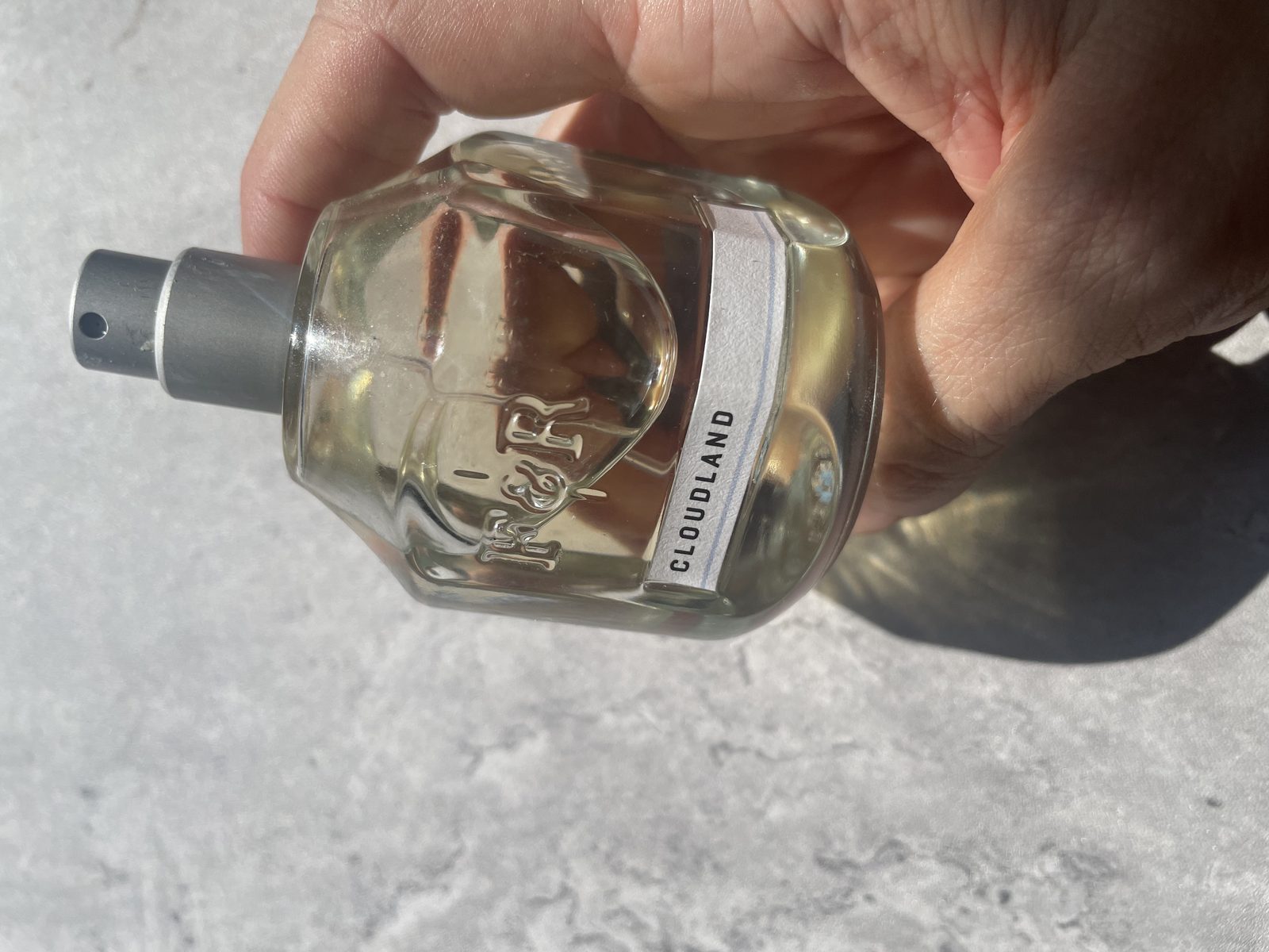 Fulton & Roark Cloudland Review: An Extrait That Won't Call Itself One Holding Fulton & Roark Cloudland with the CLOUDLAND label band and embossed F&R monogram facing camera