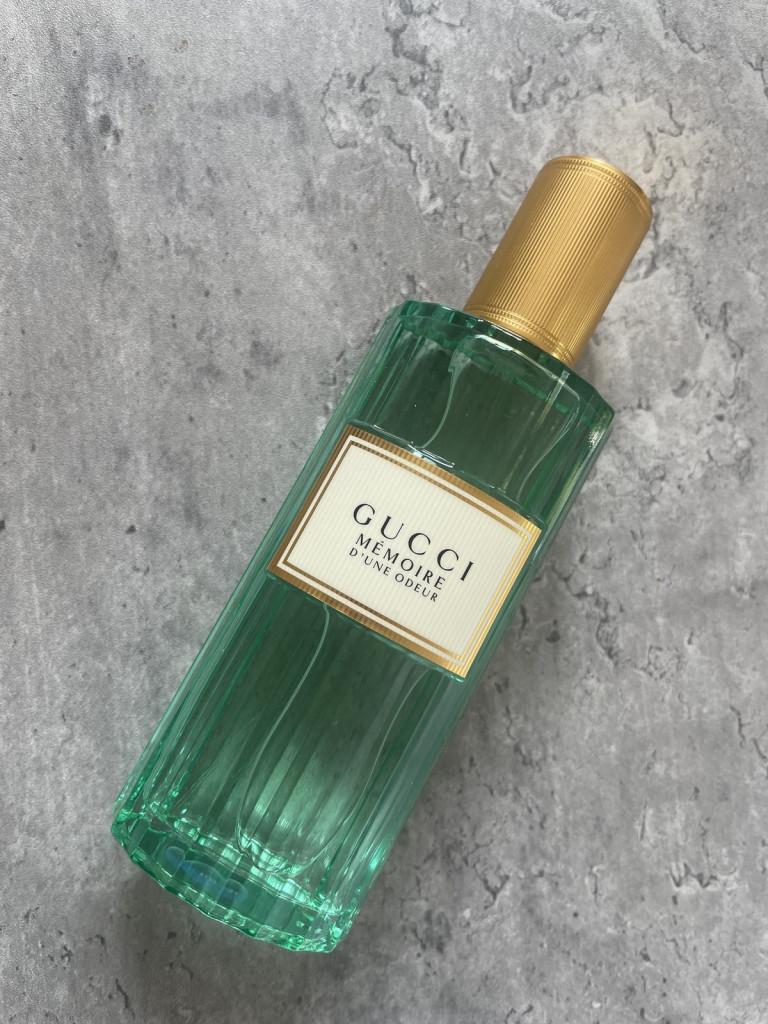Gucci Memoire d’une Odeur EDP bottle on a concrete surface