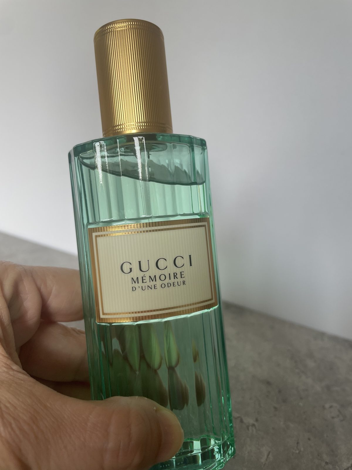Gucci Memoire d’une Odeur EDP Review: Soothing & Soft Part-used bottle of Gucci Memoire d’une Odeur EDP held in hand