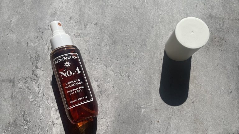 MCoBeauty No.4 Vanilla & Macadamia fragrance mist on sunlit concrete
