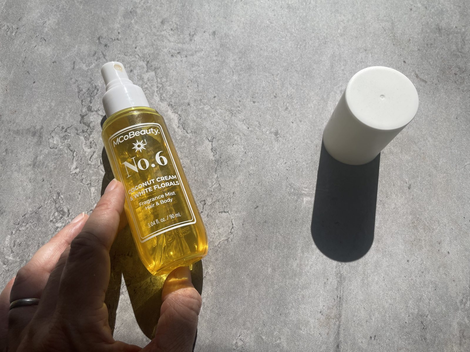 MCoBeauty No.6 Coconut Cream Review: The Batch Code Its Sibling Hides Holding MCoBeauty No.6 Coconut Cream & White Florals, 3.04 fl oz / 90 mL hair and body fragrance mist