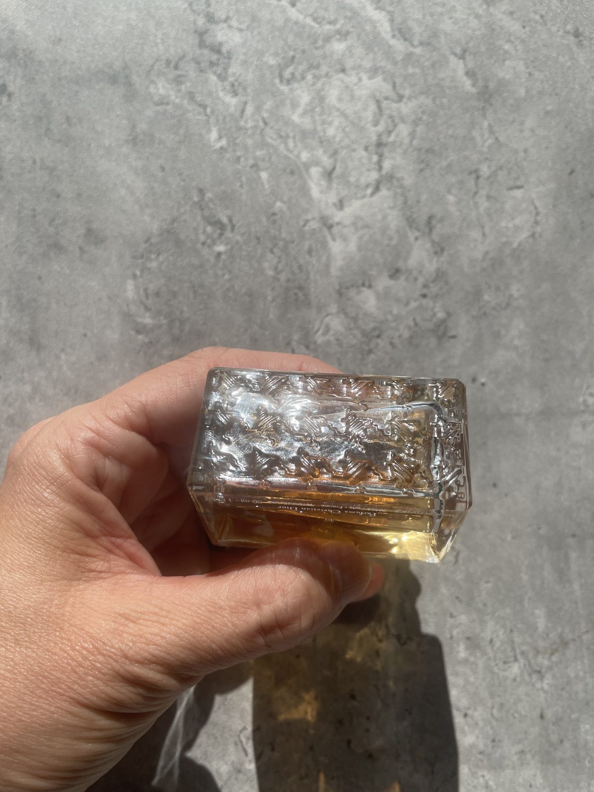 Miss Dior Perfume: The Modern and Airy Fragrance Reviewed Base of the Miss Dior Eau de Parfum bottle showing the moulded hobnail glass, Parfum Christian Dior, made in France, 30ml