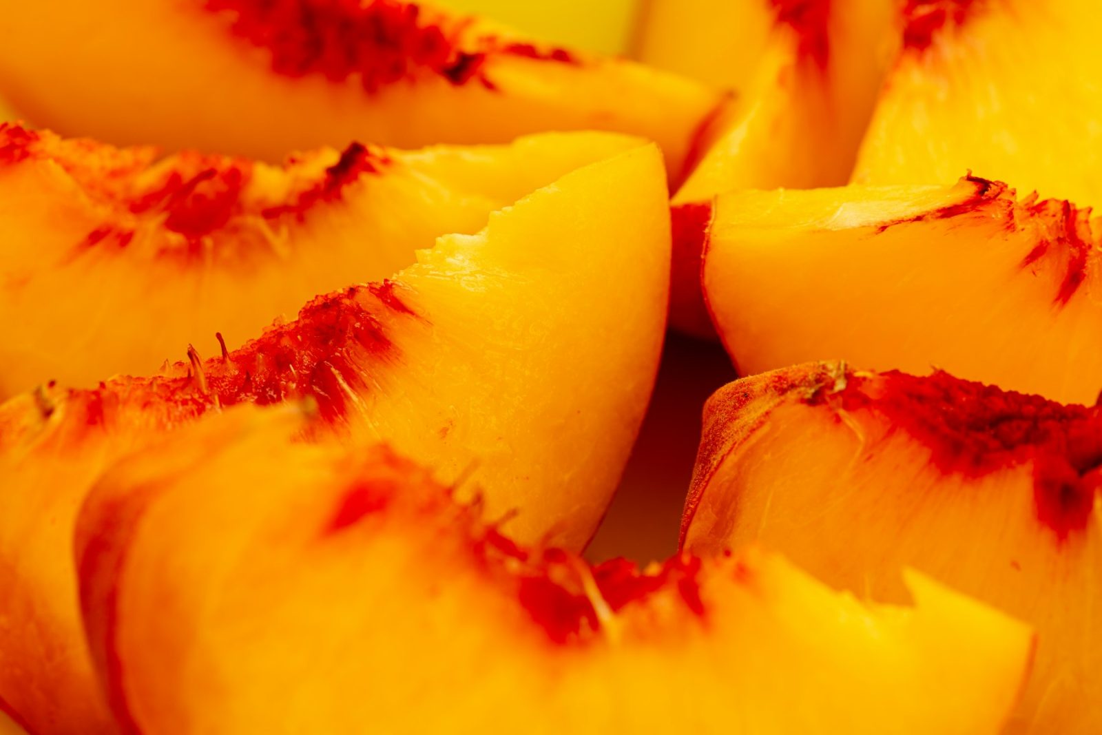 What Does Peach Smell Like? Sliced peach flesh in close-up, the lactonic creaminess behind gamma-undecalactone