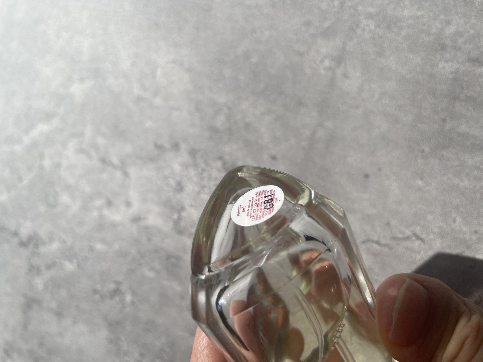 Is The Evocative Fragrance Of Tommy Girl Perfume For You? Base sticker on the Tommy Girl bottle showing batch code G81, eau de toilette 1.0 fl oz 30ml, made in USA